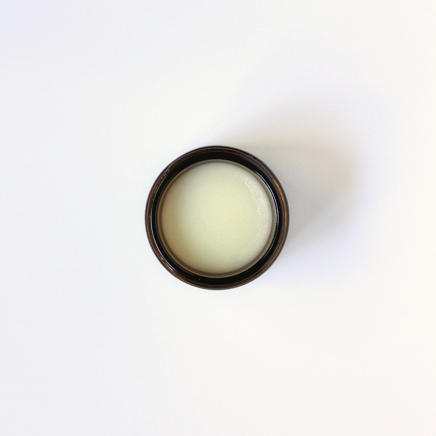 Jar of grass fed tallow balm on a white background